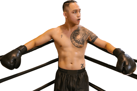 Man wearing boxing gloves standing in the corner of the ring [📷: RDNE Stock project from pexels.com]